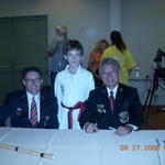 This is me with Grand Master Lee and his assistant.  He signed my bow staff.
